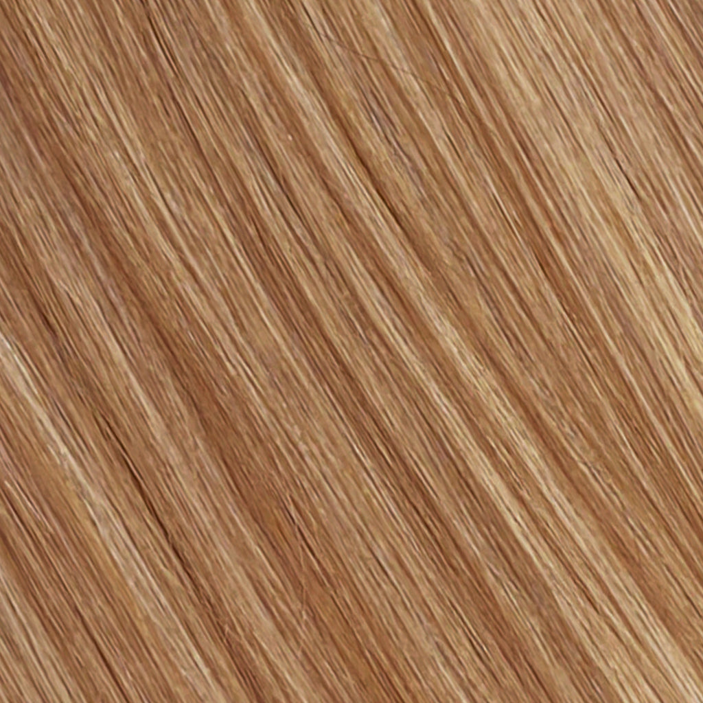 Close-up of brown hair extensions with a gradient.